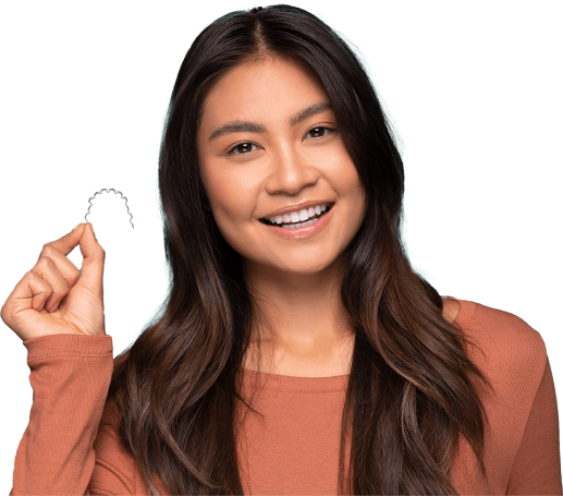 Adult at Schwartz Orthodontics holding the InBrace Smartwire